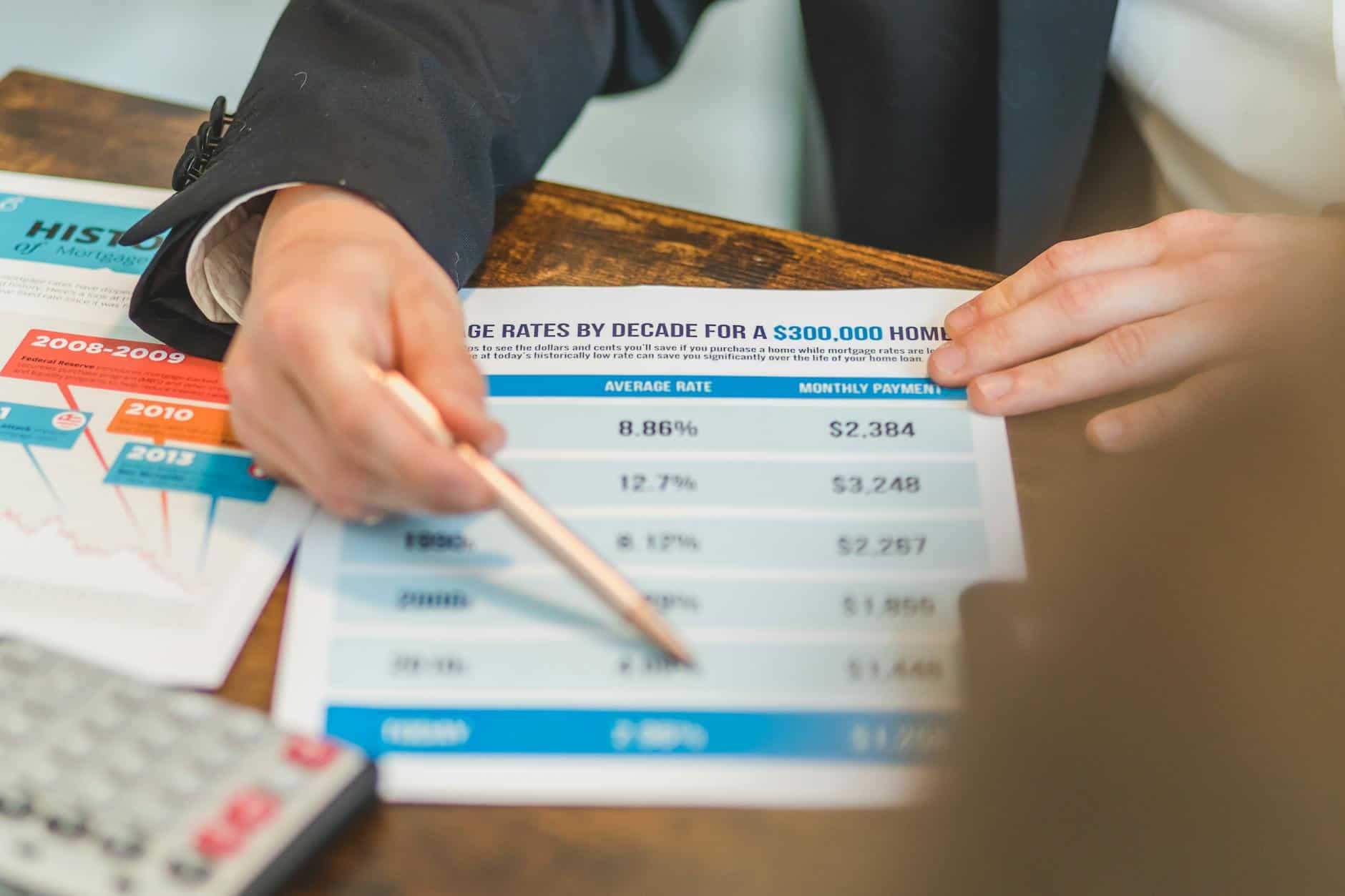 Mortgage and loan documents reviewed at a desk